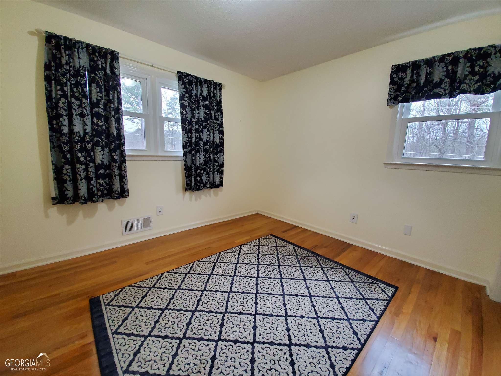 48 Leigh Street Commerce, GA 30529 - Photo 14 of 22 a view of a room with wooden floor and windows