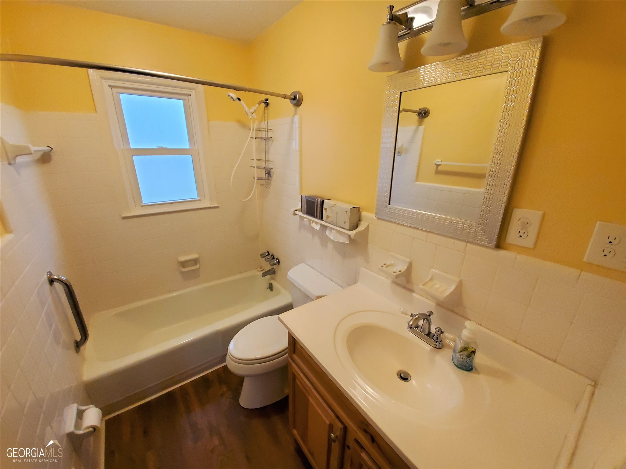 48 Leigh Street Commerce, GA 30529 - Photo 15 of 22 a bathroom with a sink toilet and shower