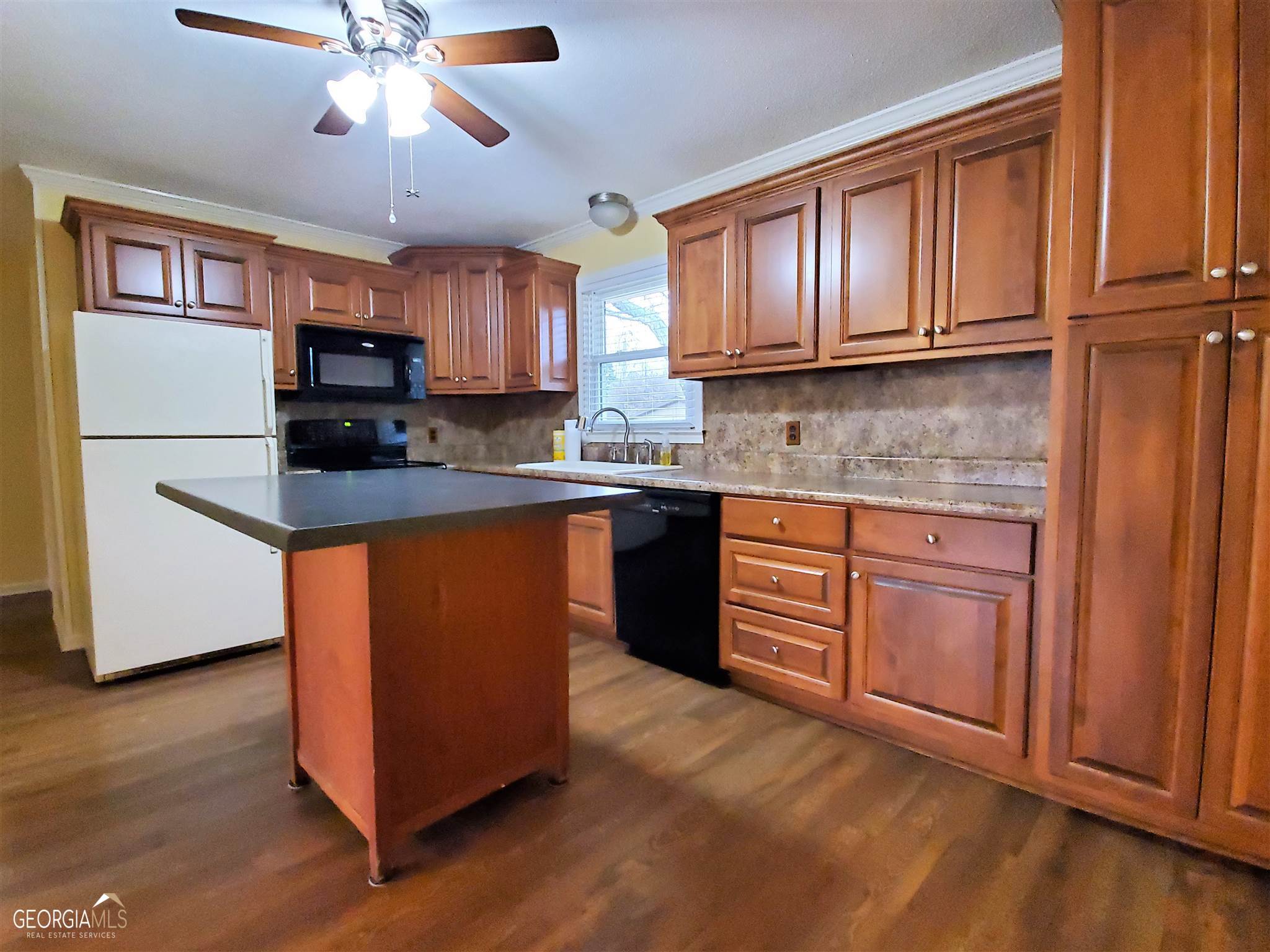 48 Leigh Street Commerce, GA 30529 - Photo 6 of 22 a kitchen with stainless steel appliances granite countertop a stove a sink dishwasher and a refrigerator