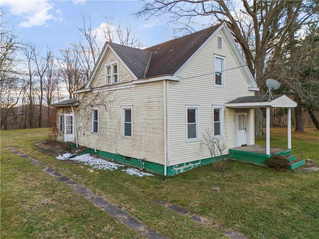 770 South Eighty Eight Road Carmichaels, PA 15320 - Photo 8 of 10 a view of a yard in front of a house with large tree