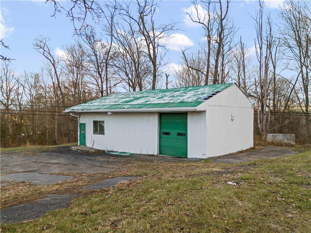 770 South Eighty Eight Road Carmichaels, PA 15320 - Photo 10 of 10 a front view of a house with a yard and garage