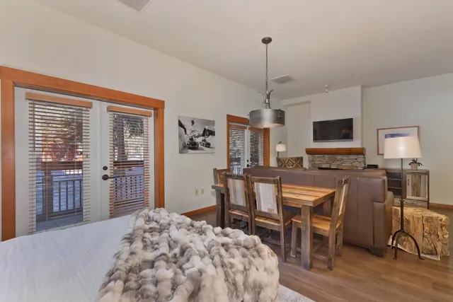 a bed room with a bed and a television