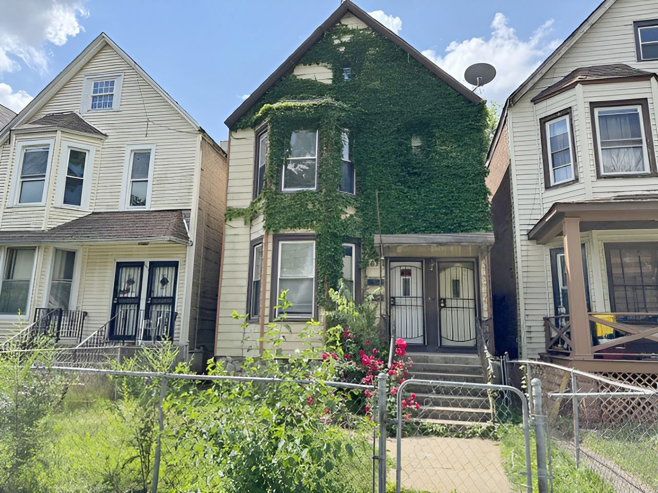 a front view of a house with garden