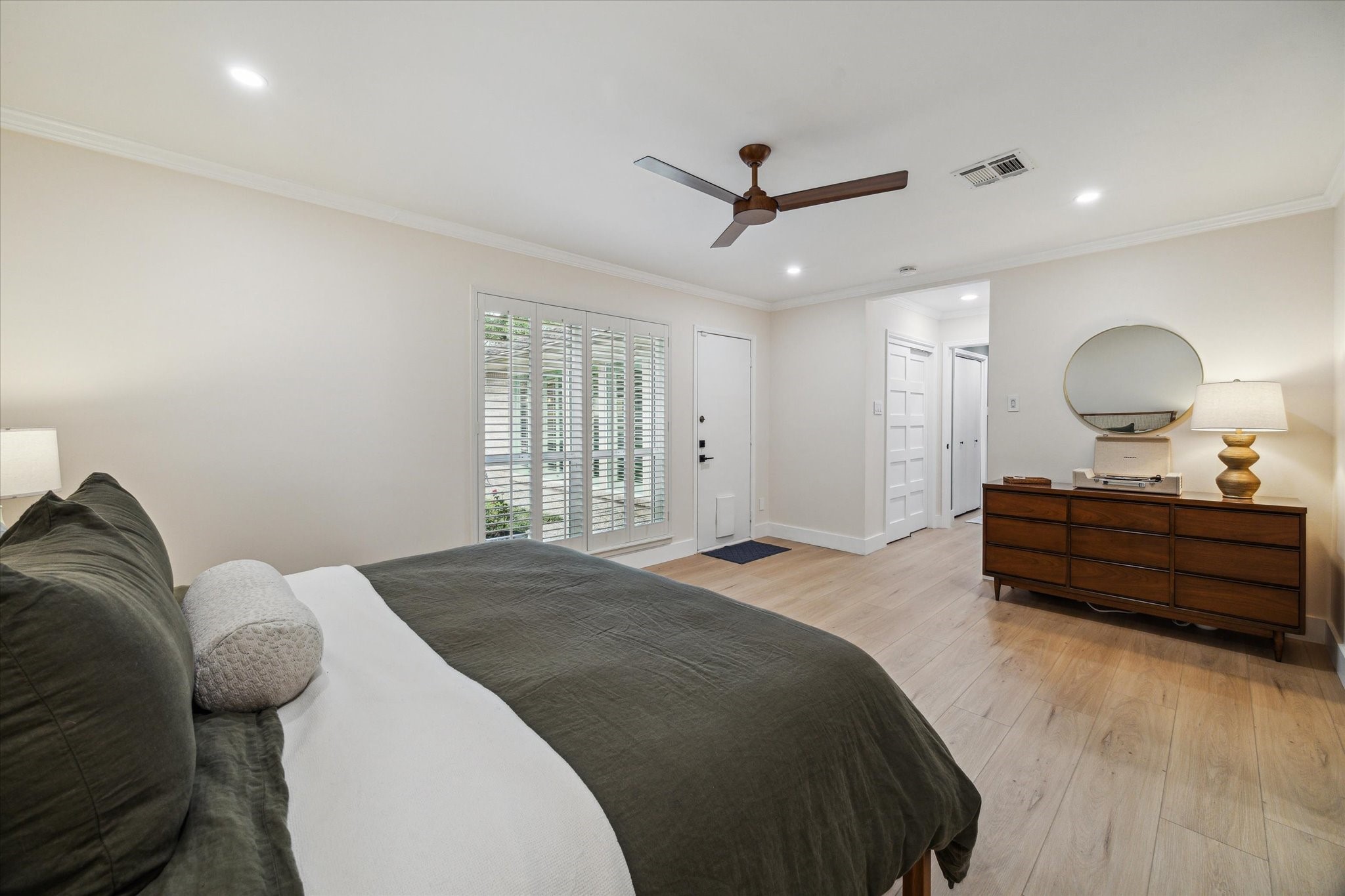 10002 Wickersham Lane Houston, TX 77042 - Photo 21 of 28 a bed room with a bed and a mirror