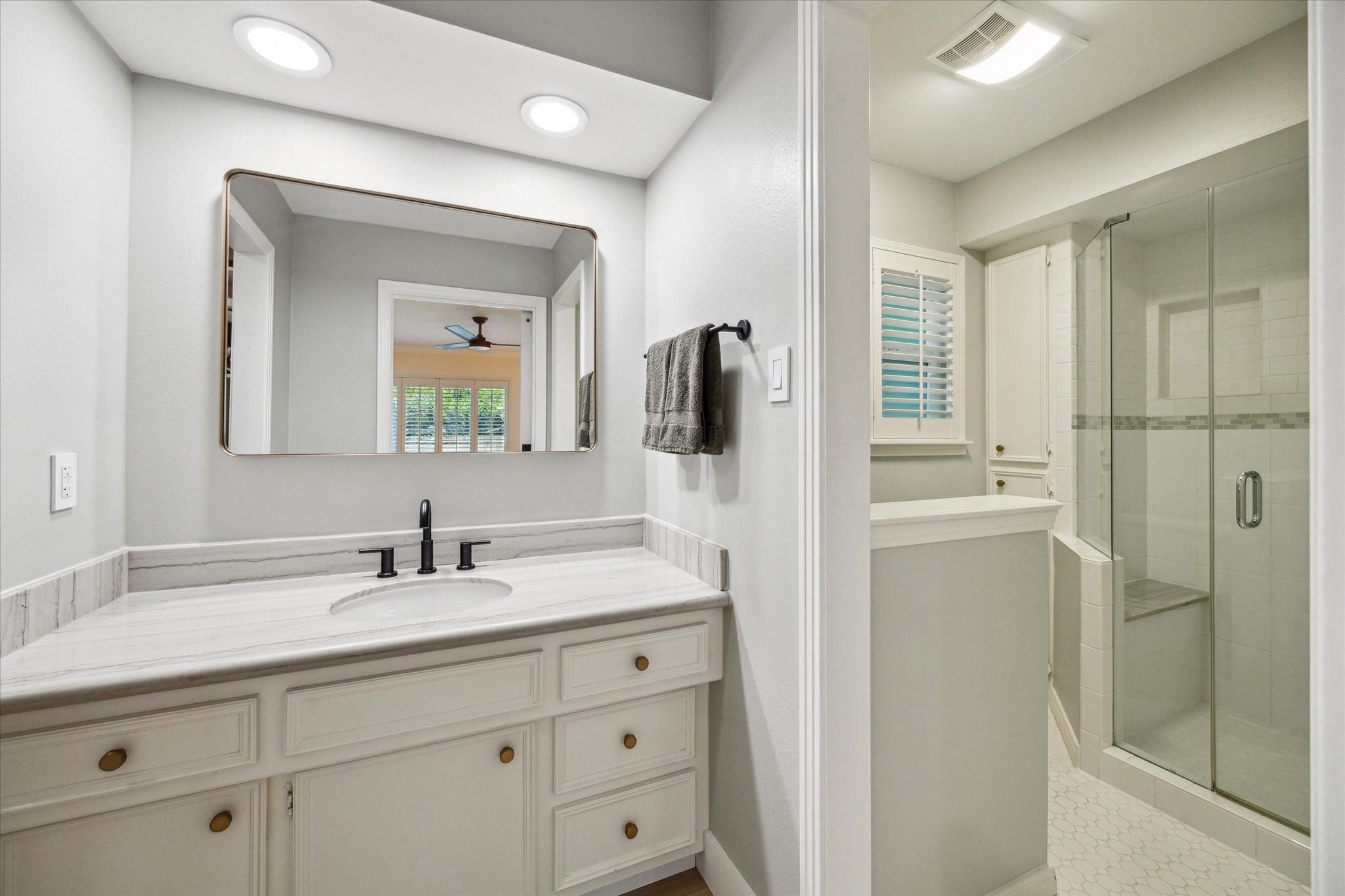 10002 Wickersham Lane Houston, TX 77042 - Photo 22 of 28 a bathroom with a double vanity sink mirror and