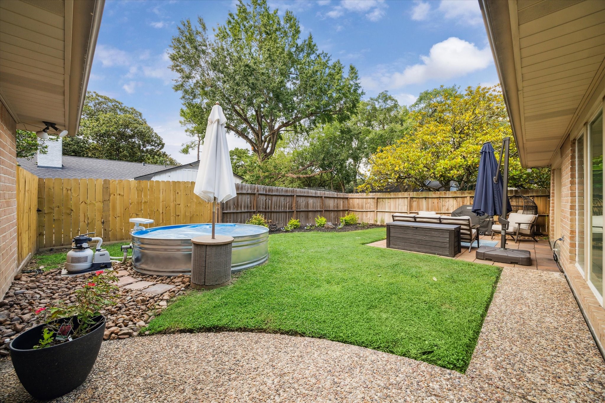 10002 Wickersham Lane Houston, TX 77042 - Photo 23 of 28 a view of a backyard with sitting area