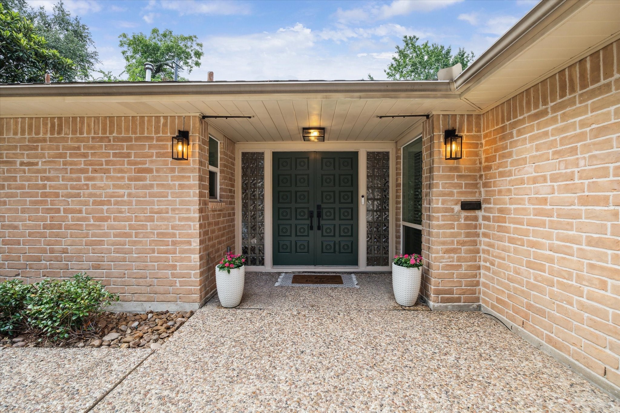 10002 Wickersham Lane Houston, TX 77042 - Photo 4 of 28 a view of a blue house with outdoor space