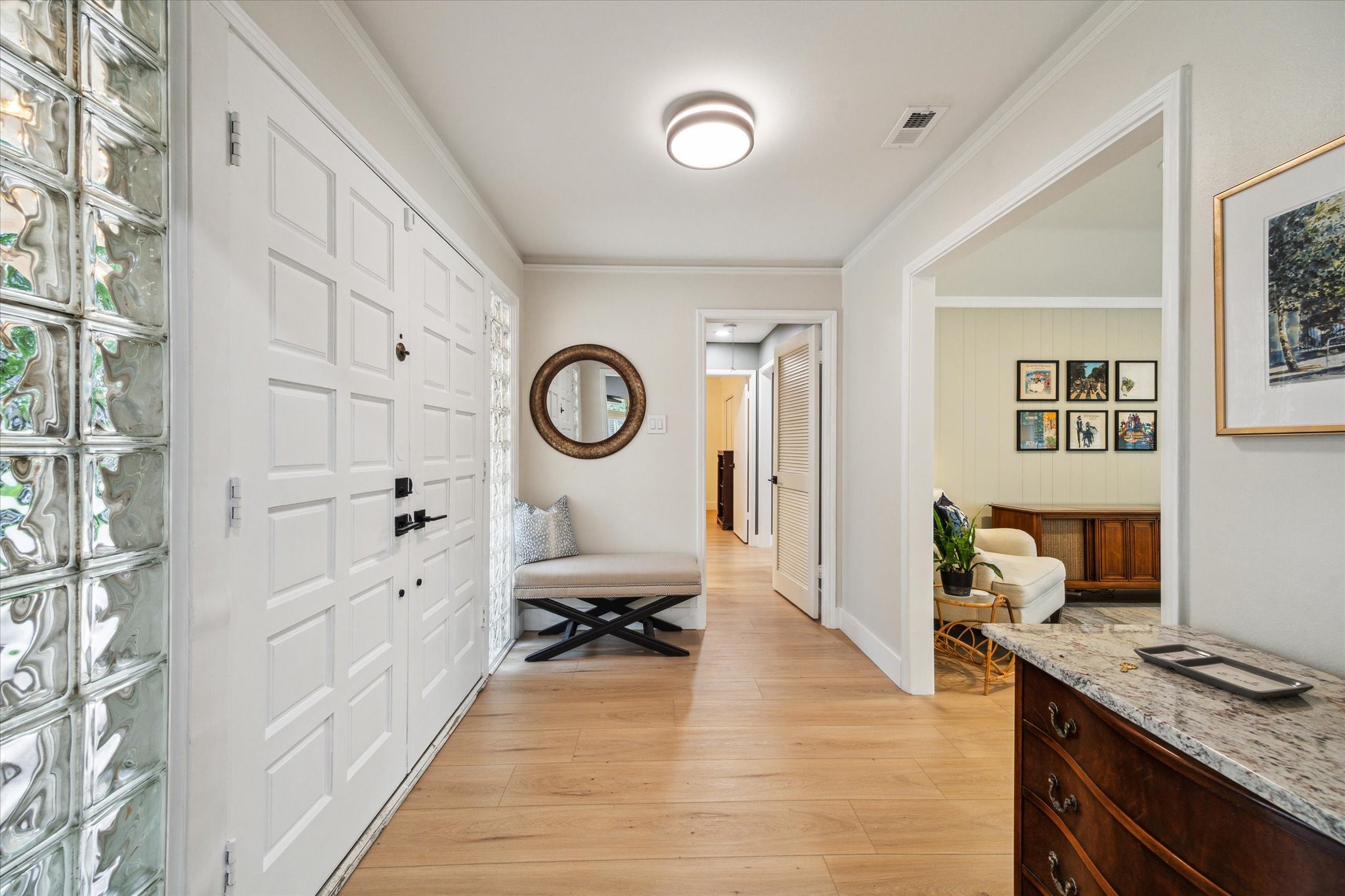 10002 Wickersham Lane Houston, TX 77042 - Photo 6 of 28 a living room with furniture and a mirror