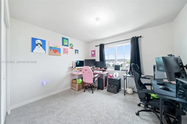 a bathroom with a sink a toilet a mirror and shower