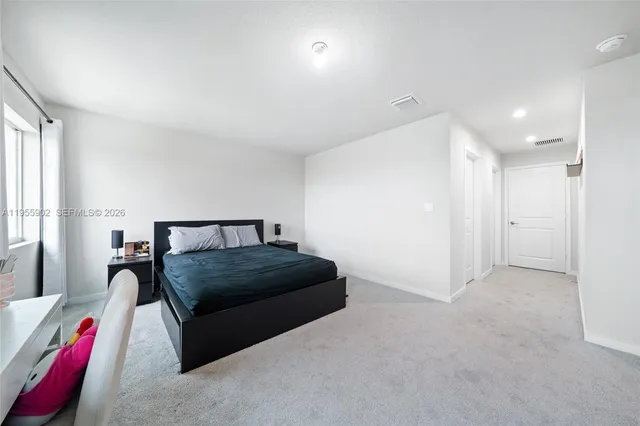 a bedroom with furniture and a couch