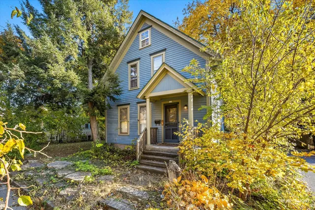 a front view of a house with a yard