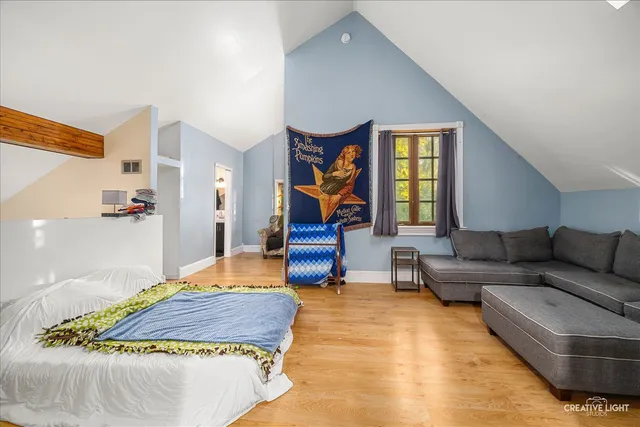 a bedroom with a bed and window