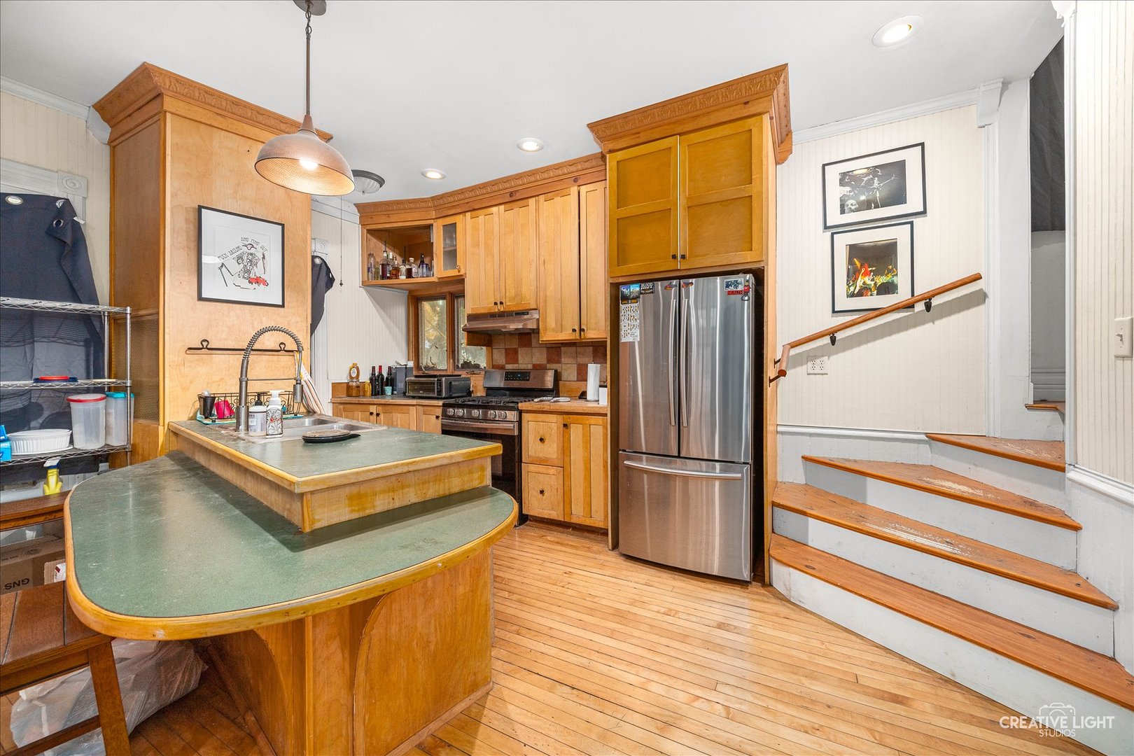 315 Congdon Avenue Elgin, IL 60120 - Photo 6 of 17 a kitchen with stainless steel appliances granite countertop a refrigerator a stove and a sink with granite countertops