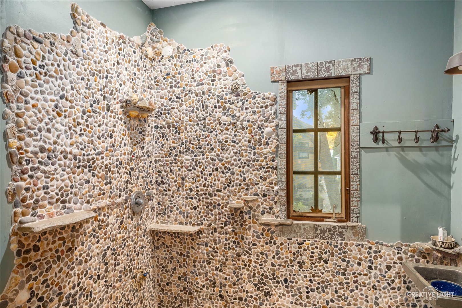 315 Congdon Avenue Elgin, IL 60120 - Photo 8 of 17 a bathroom with a shower curtain and a window