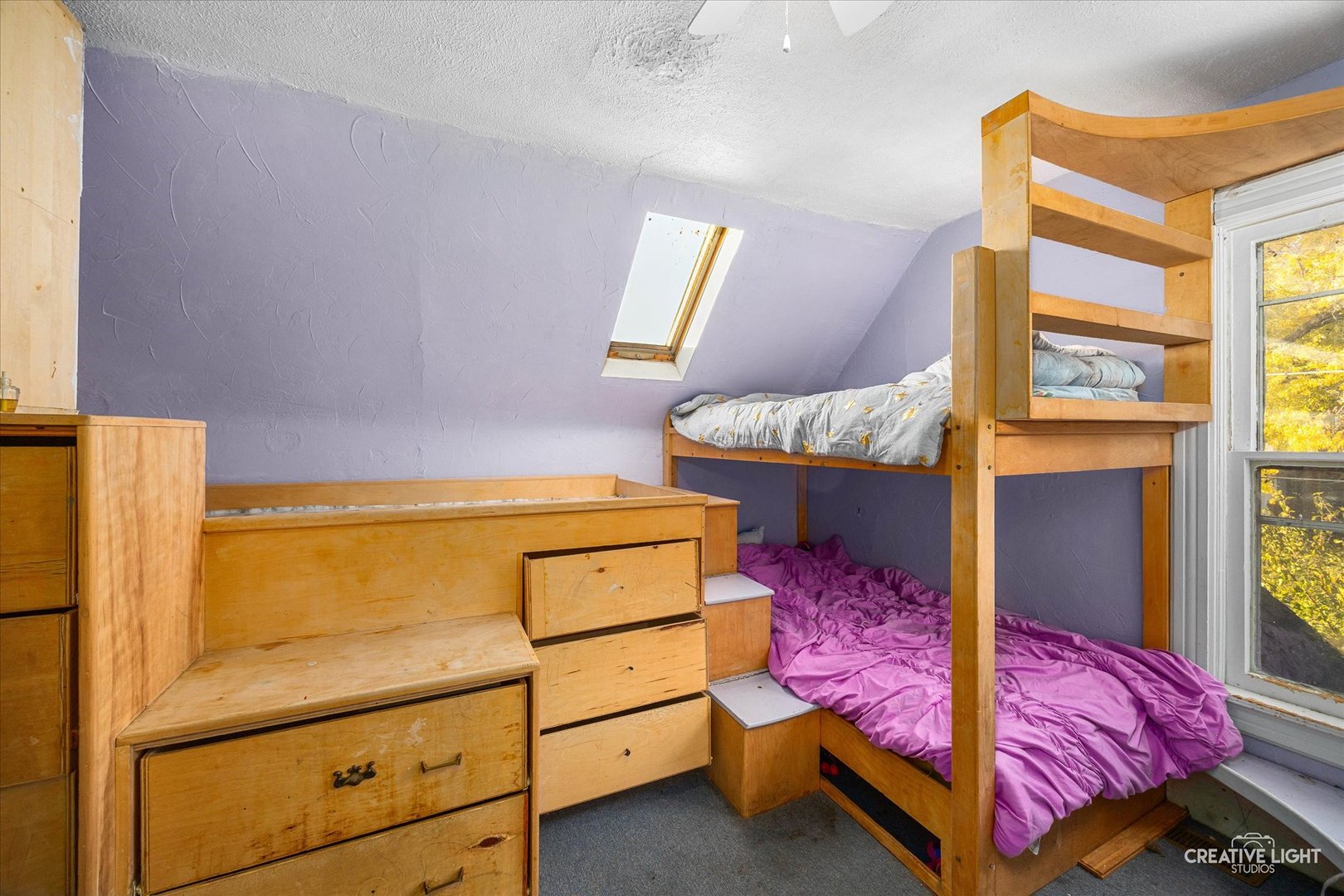 315 Congdon Avenue Elgin, IL 60120 - Photo 9 of 17 a bedroom with a bed and a dresser