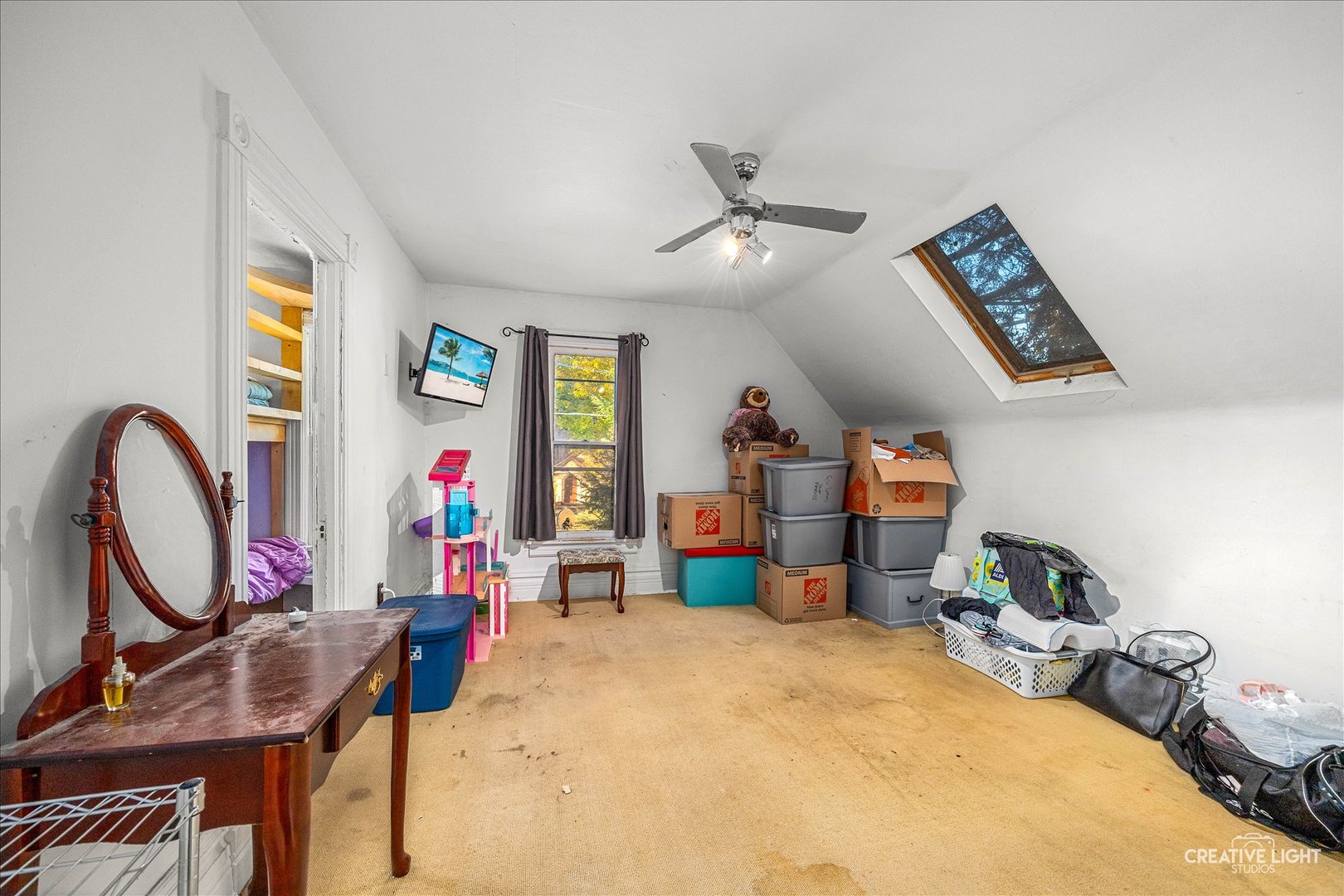 315 Congdon Avenue Elgin, IL 60120 - Photo 10 of 17 a bed room with a bed mirror and a window