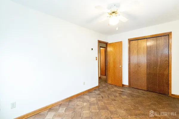 a view of livingroom with hardwood floor and a ceiling fan