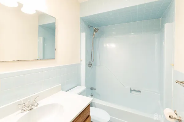 a view of house with backyard and a chair