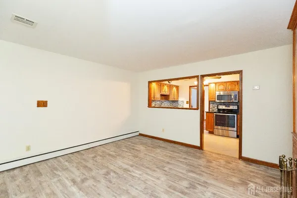 a view of an empty room with a window