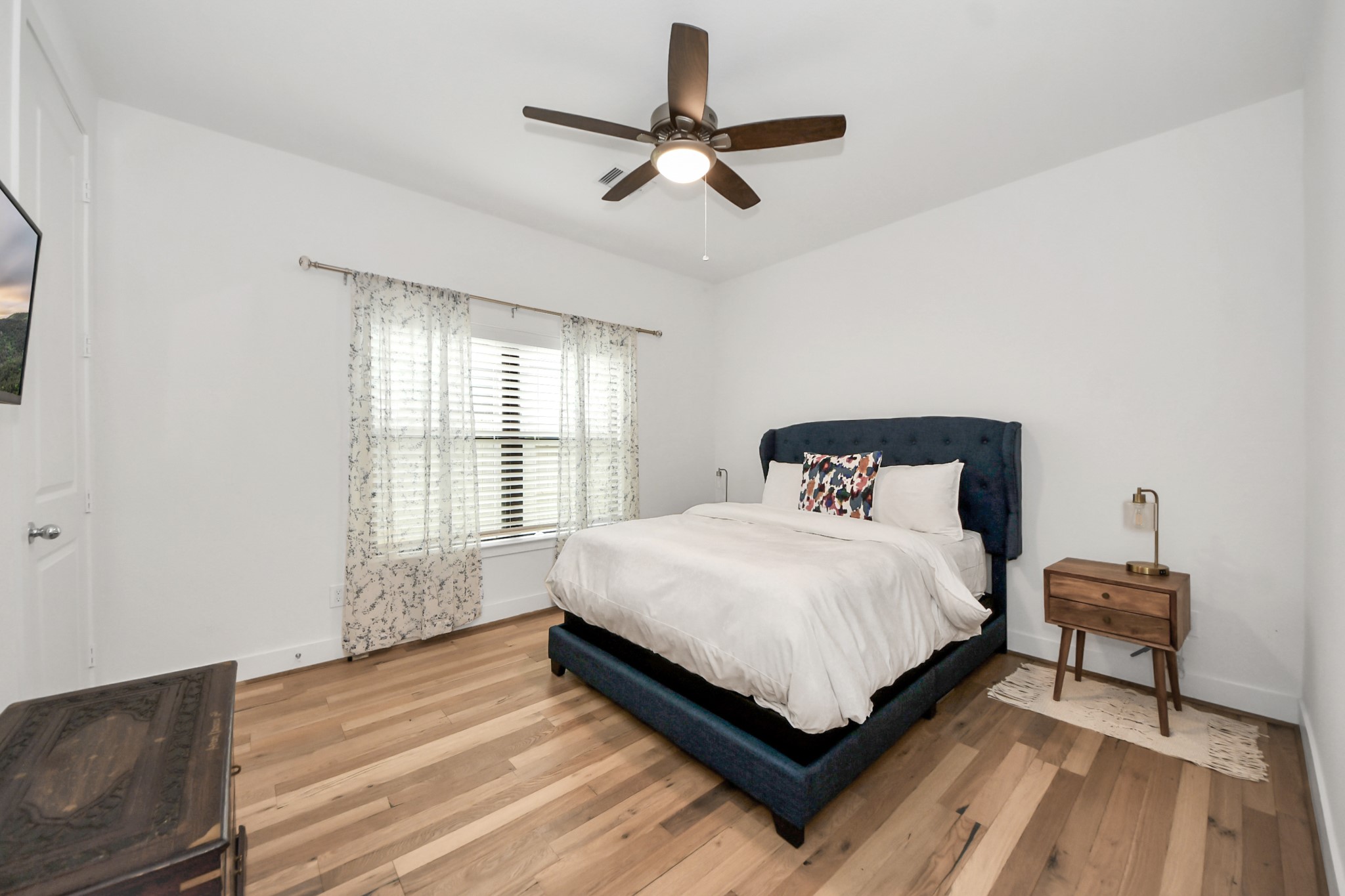 17355 Camillia Trail Conroe, TX 77302 - Photo 18 of 34 a bedroom with a bed and window