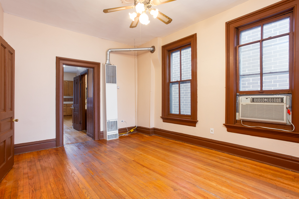 652 West Webster Avenue, Unit 2 Chicago, IL 60614 - Photo 3 of 11 a view of an empty room with wooden floor and a window