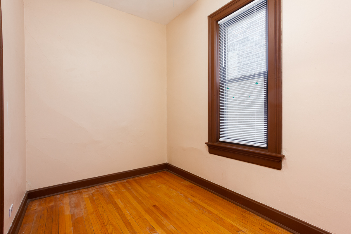 652 West Webster Avenue, Unit 2 Chicago, IL 60614 - Photo 8 of 11 an empty room with a window