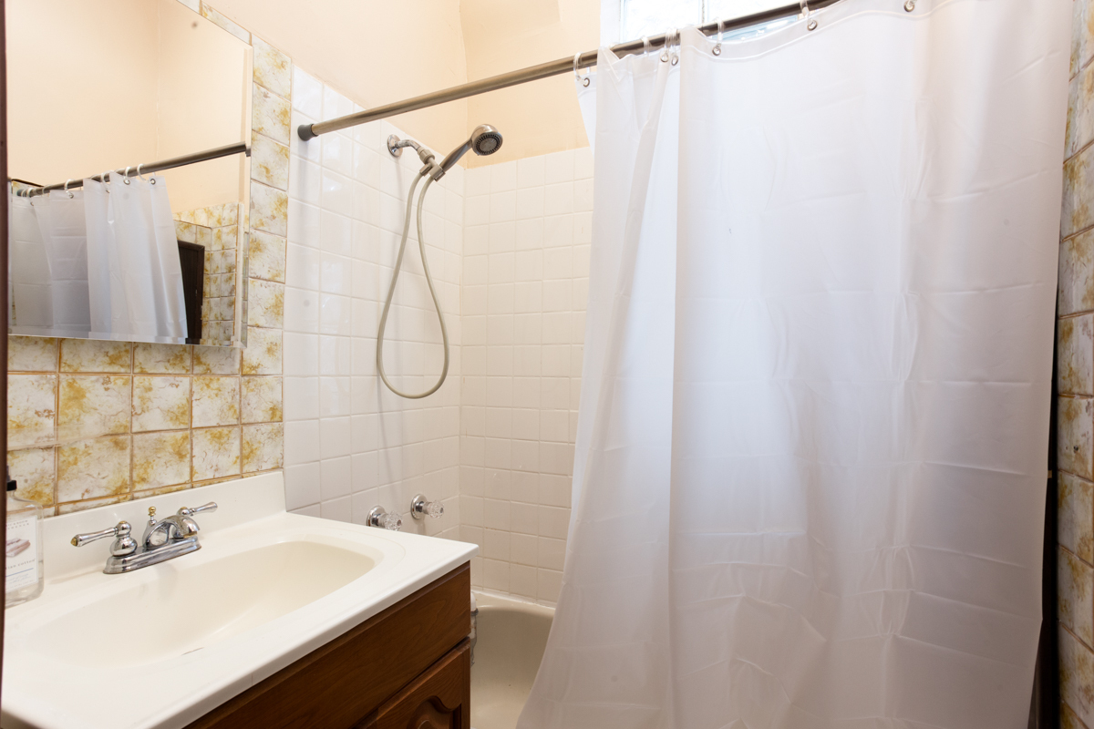 652 West Webster Avenue, Unit 2 Chicago, IL 60614 - Photo 10 of 11 a bathroom with a sink vanity mirror and shower
