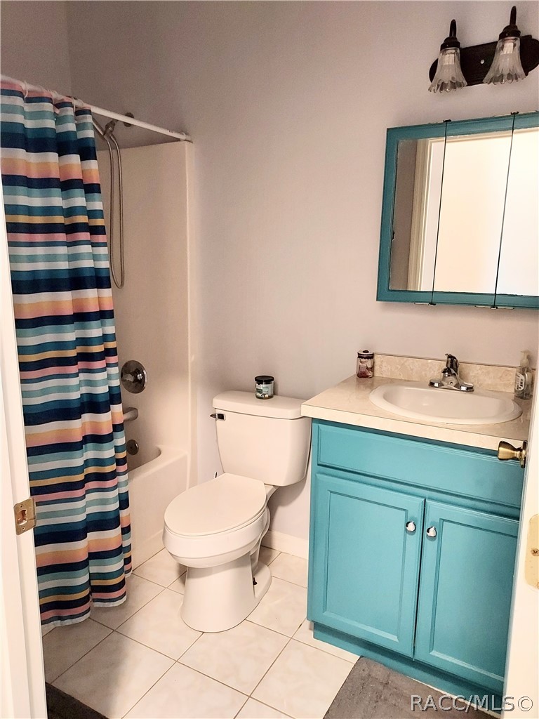 9306 East Gospel Island Road Inverness, FL 34450 - Photo 5 of 16 a bathroom with a sink mirror vanity and toilet