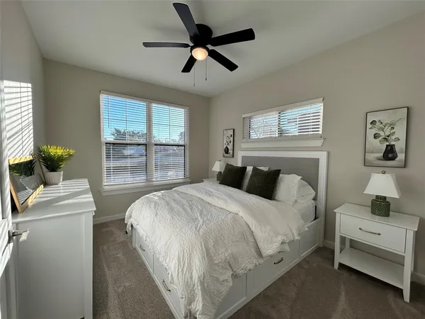 a bedroom with a bed and a couch