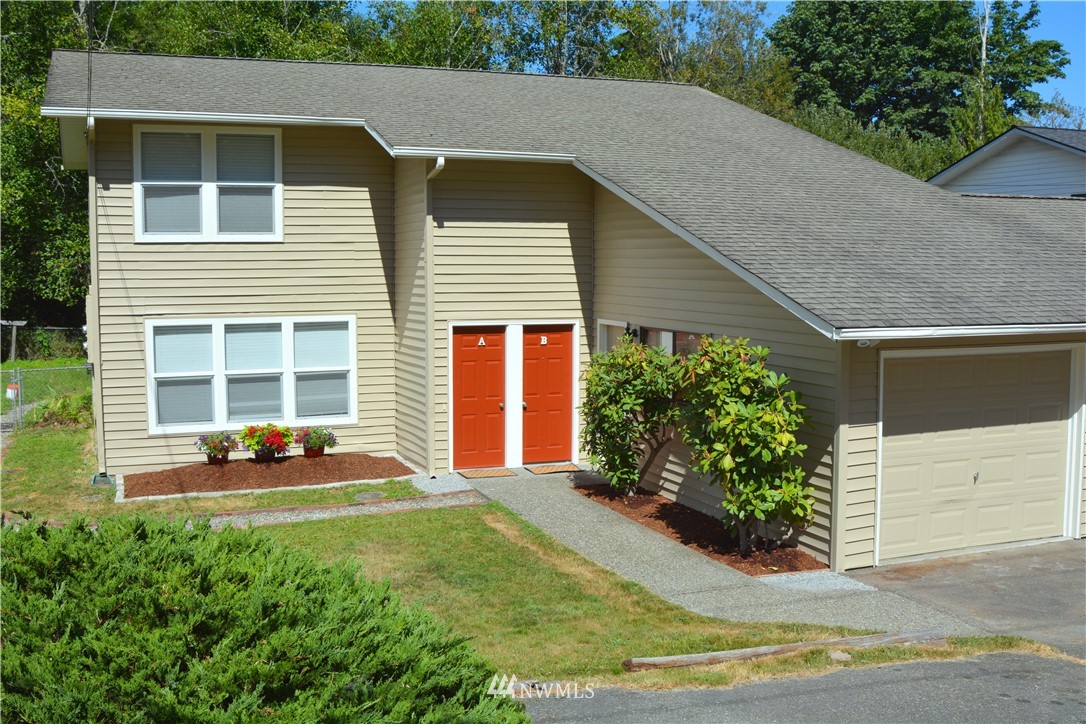 20515 Filbert Drive Bothell, WA 98012 - Photo 1 of 20 a front view of a house with garden