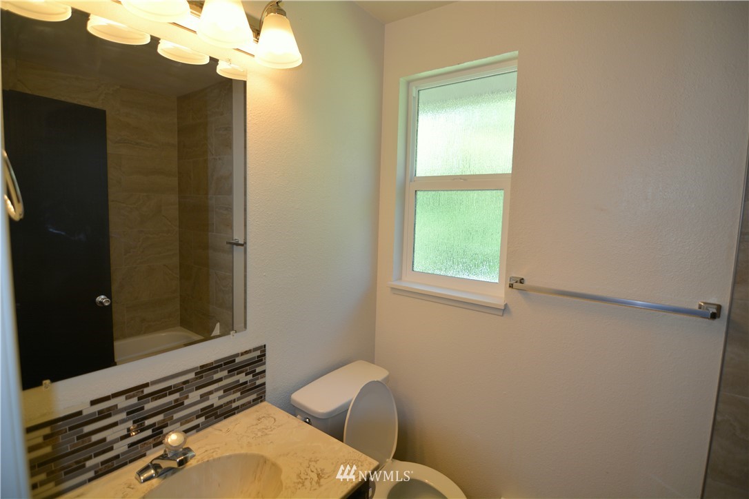 20515 Filbert Drive Bothell, WA 98012 - Photo 14 of 20 a bathroom with a sink mirror and toilet