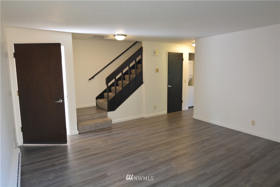 20515 Filbert Drive Bothell, WA 98012 - Photo 4 of 20 a view of an empty room with wooden floor