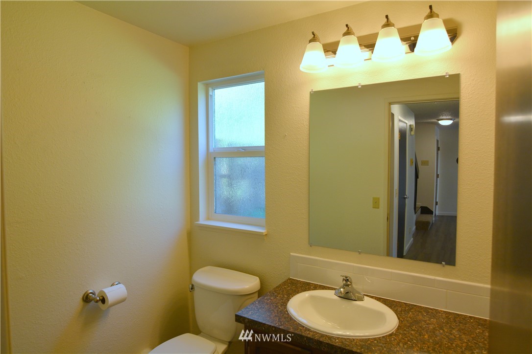 20515 Filbert Drive Bothell, WA 98012 - Photo 7 of 20 a bathroom with a toilet sink and mirror