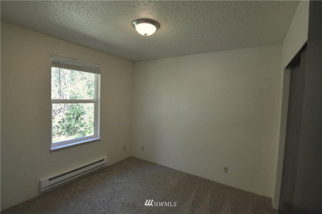 20515 Filbert Drive Bothell, WA 98012 - Photo 10 of 20 an empty room with a window