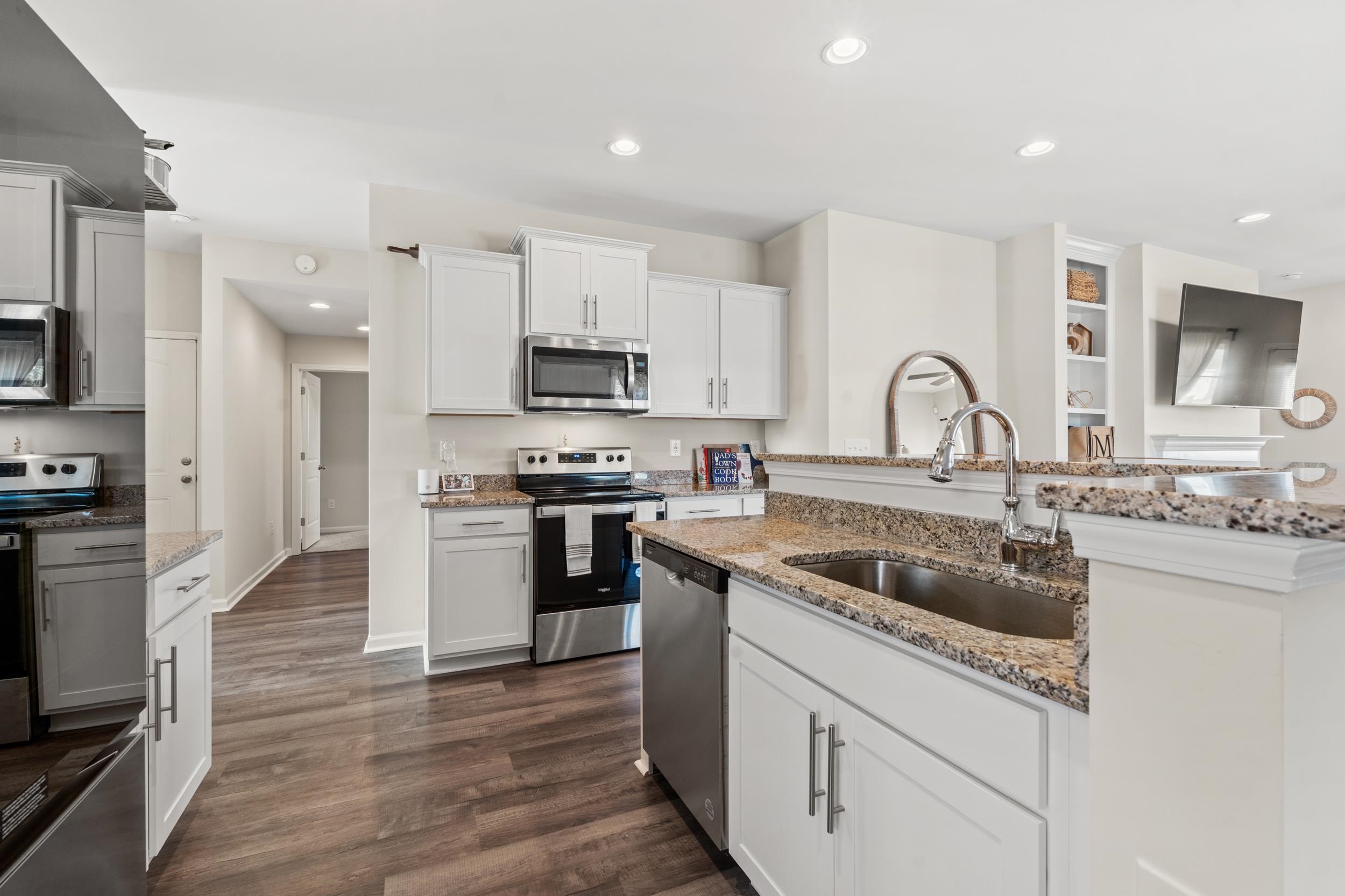 361 Palmetto Sand Loop Conway, SC 29527 - Photo 11 of 28 Kitchen featuring stainless steel appliances, recessed lighting, white cabinets, and light stone countertops