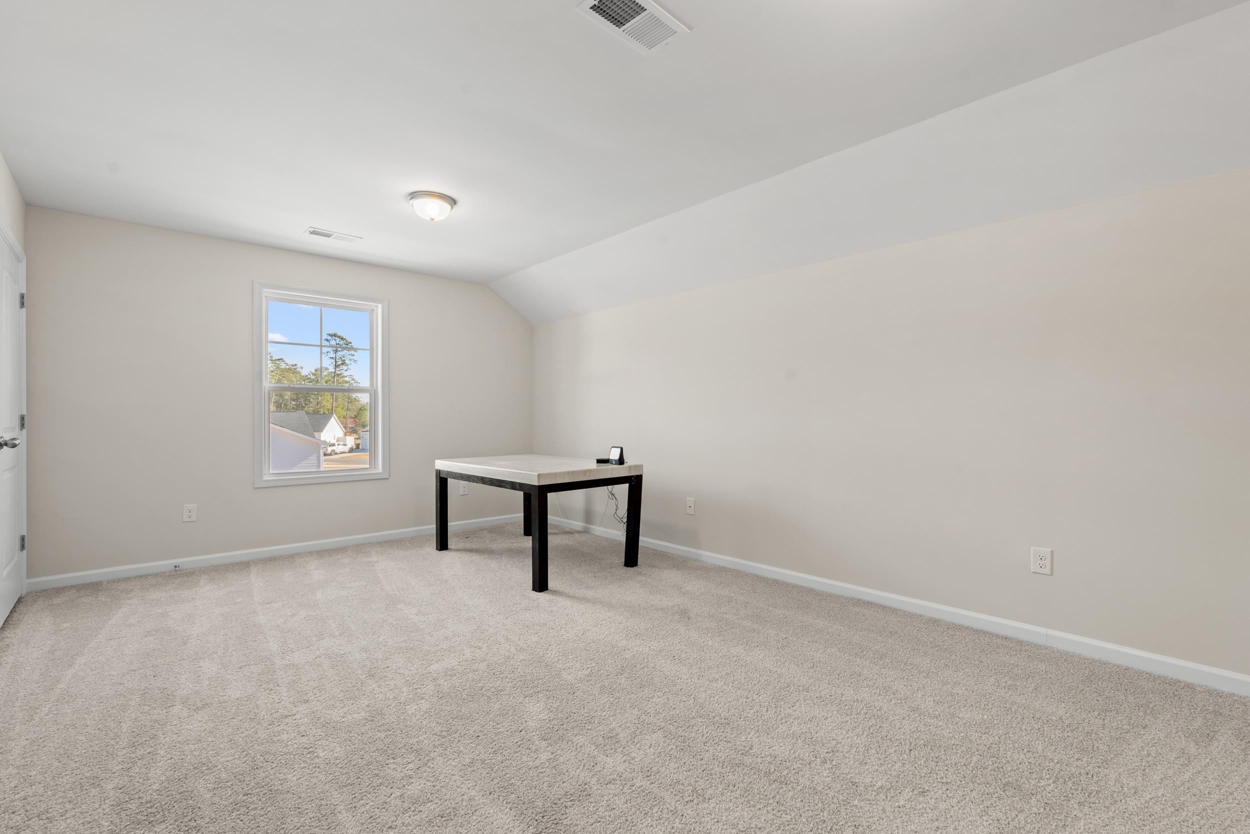 361 Palmetto Sand Loop Conway, SC 29527 - Photo 22 of 28 Additional living space featuring light carpet and lofted ceiling