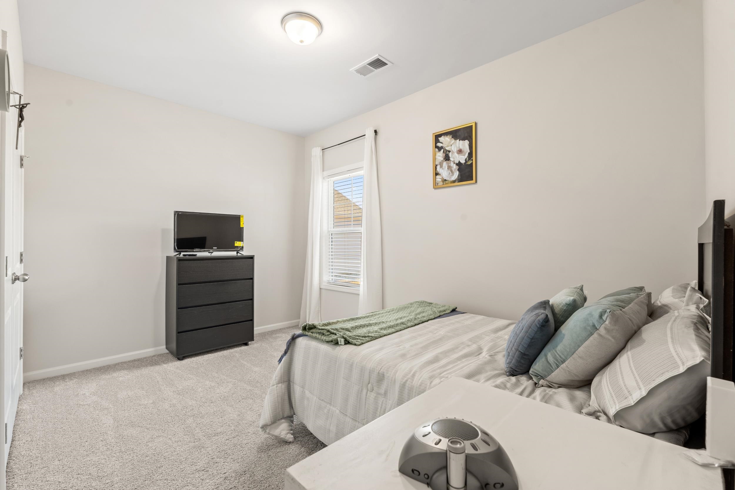 361 Palmetto Sand Loop Conway, SC 29527 - Photo 24 of 28 Bedroom featuring light colored carpet and baseboards