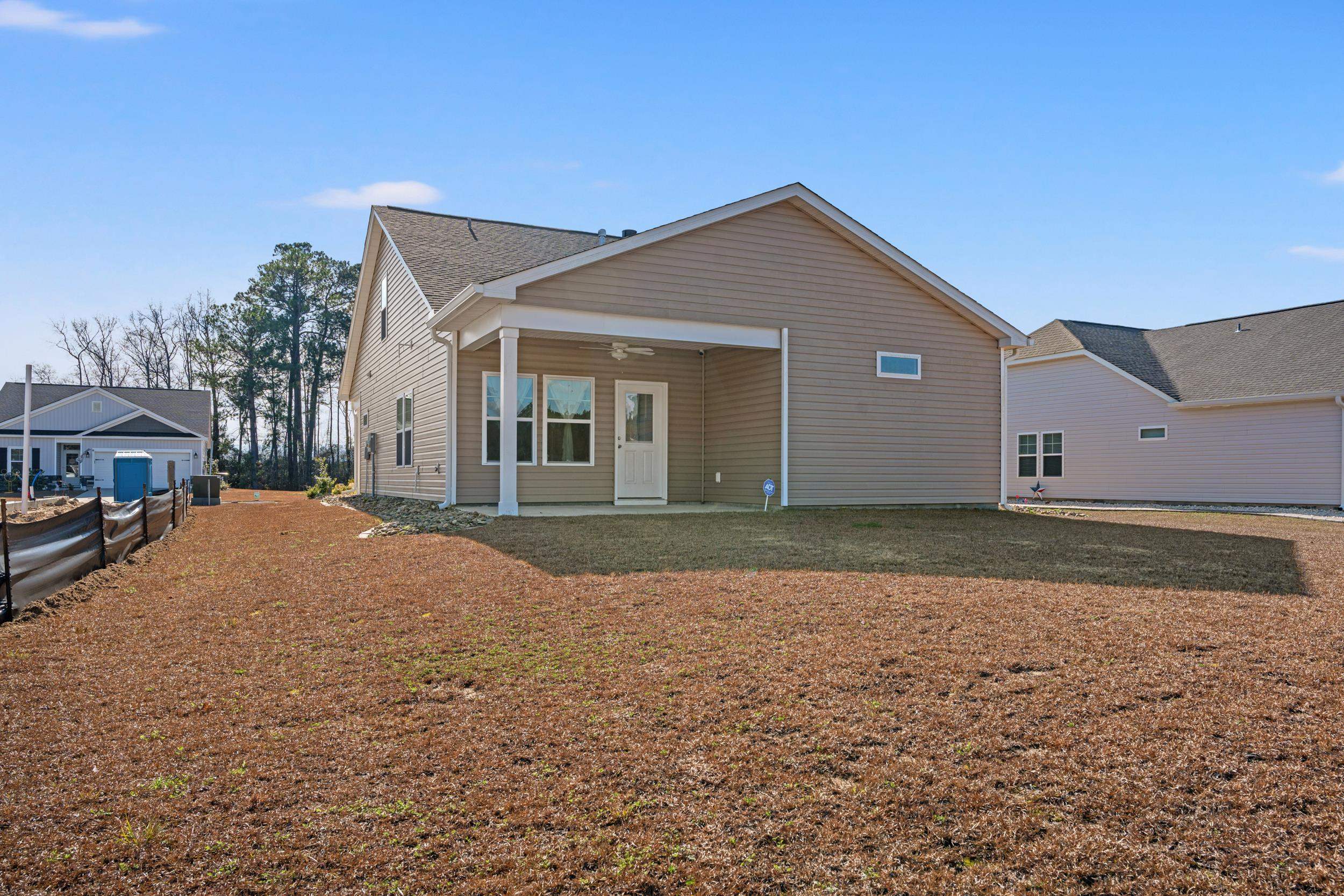 361 Palmetto Sand Loop Conway, SC 29527 - Photo 27 of 28 Rear view of property featuring a patio area, a ceiling fan, and a yard
