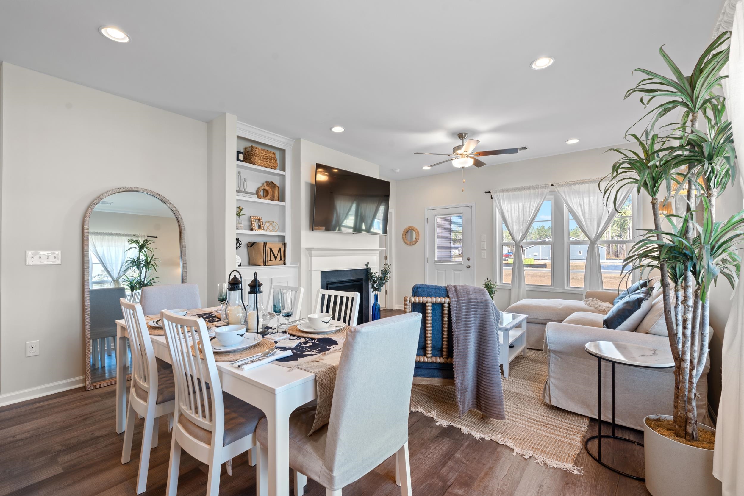 361 Palmetto Sand Loop Conway, SC 29527 - Photo 5 of 28 Dining area with a fireplace, built in features, recessed lighting, dark wood-style flooring, and a ceiling fan