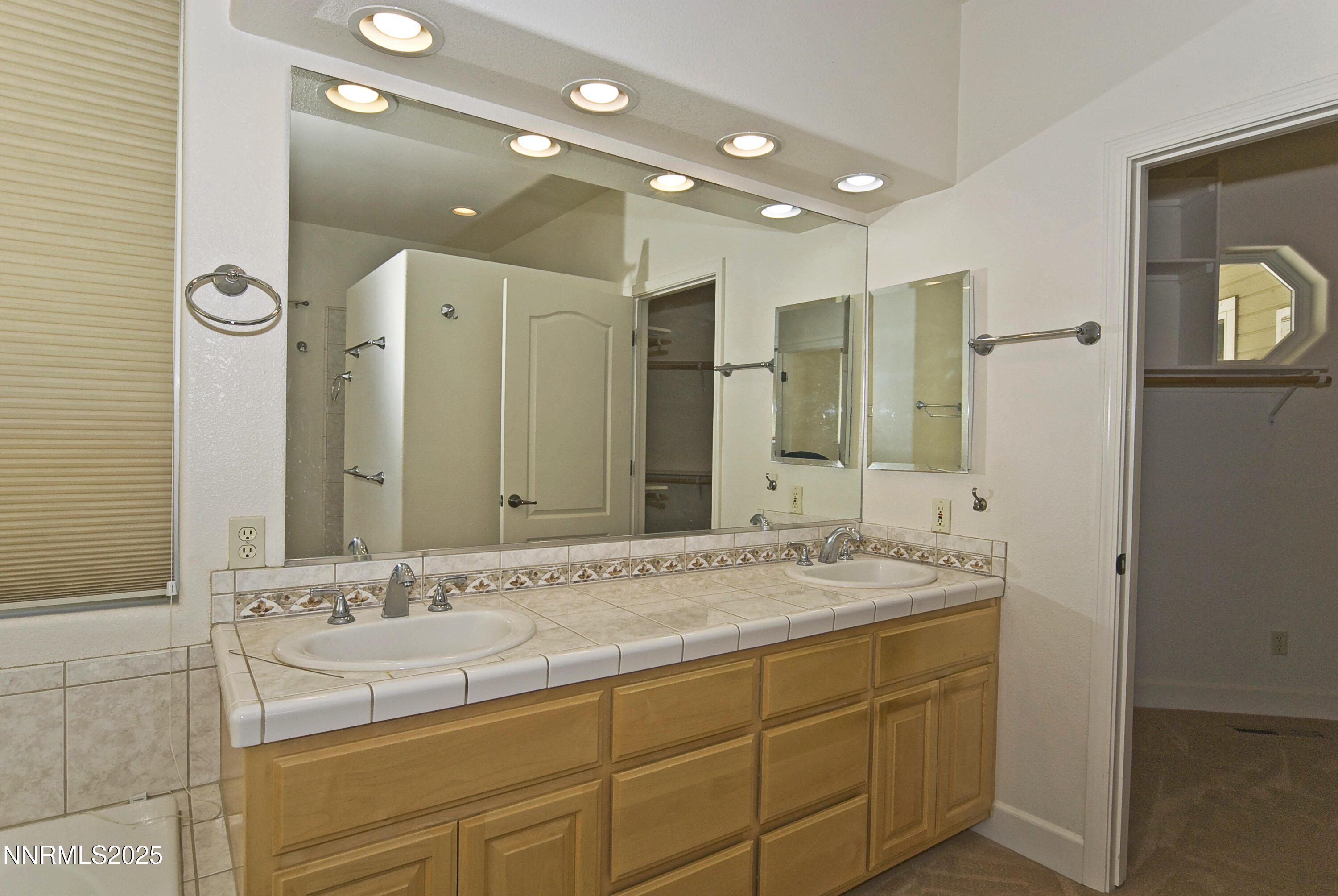 45 Lower Colony Road Wellington, NV 89444 - Photo 14 of 41 a bathroom with a sink double vanity and a mirror