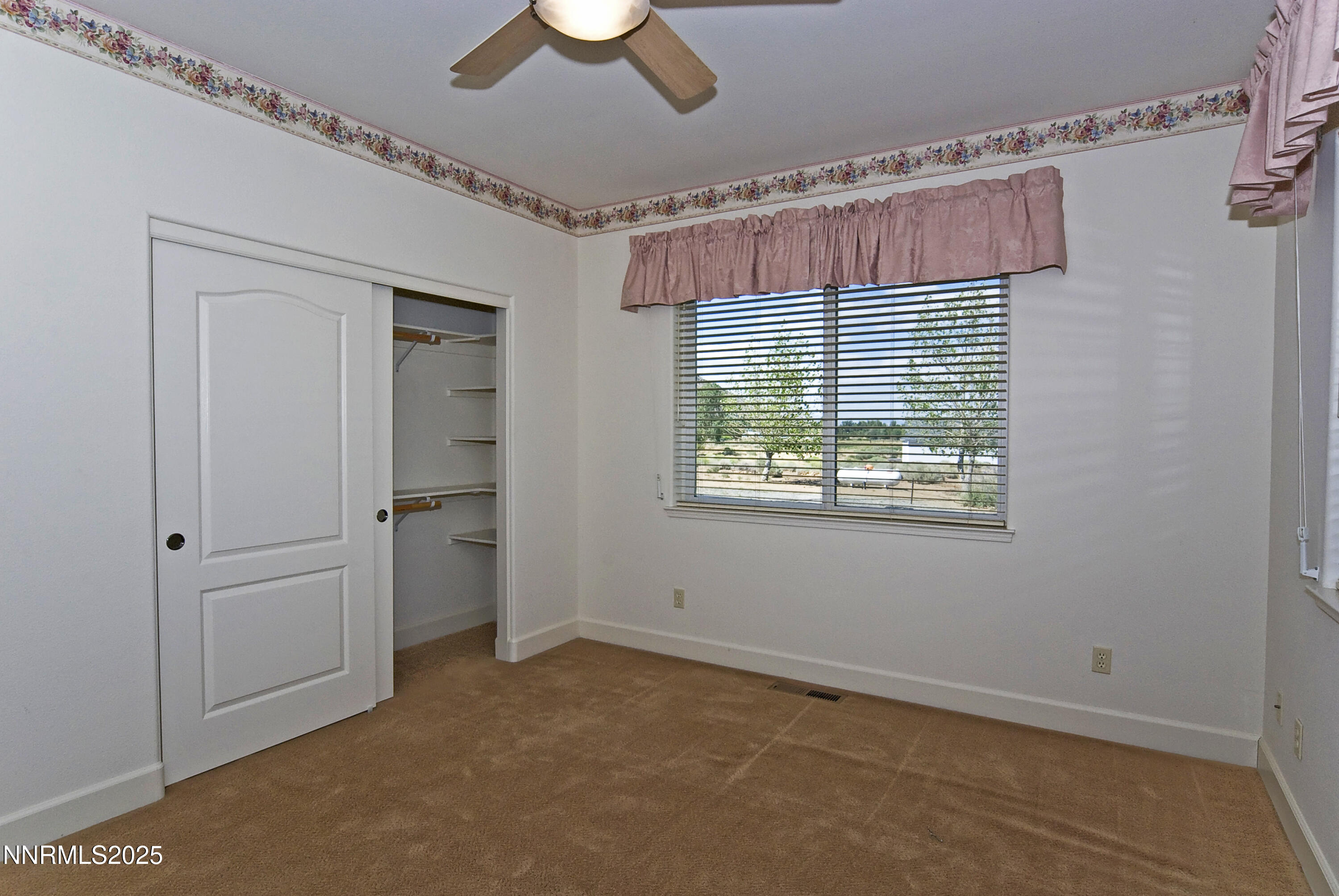 45 Lower Colony Road Wellington, NV 89444 - Photo 23 of 41 an empty room with windows and fan