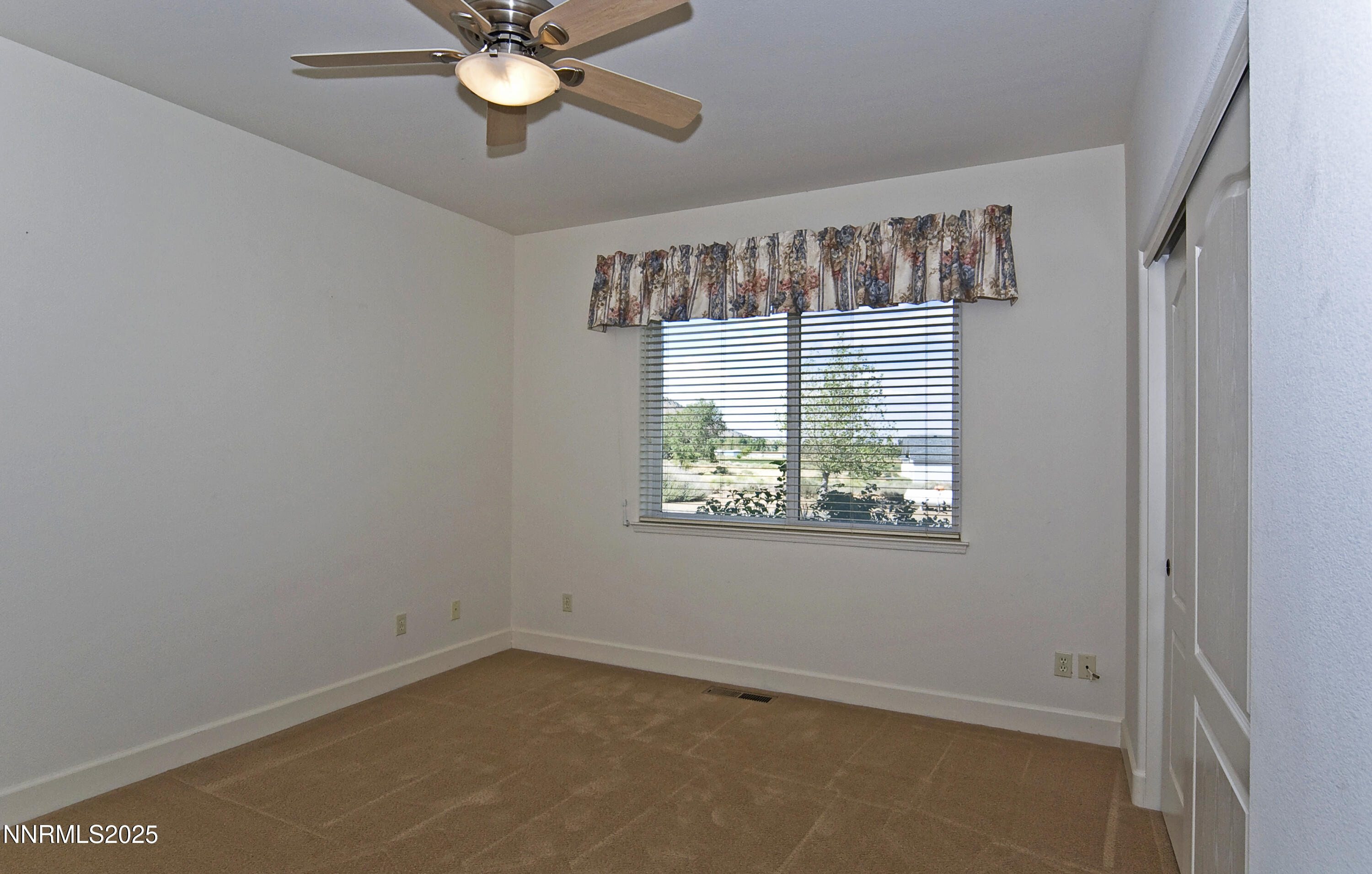 45 Lower Colony Road Wellington, NV 89444 - Photo 25 of 41 a view of a livingroom with a window