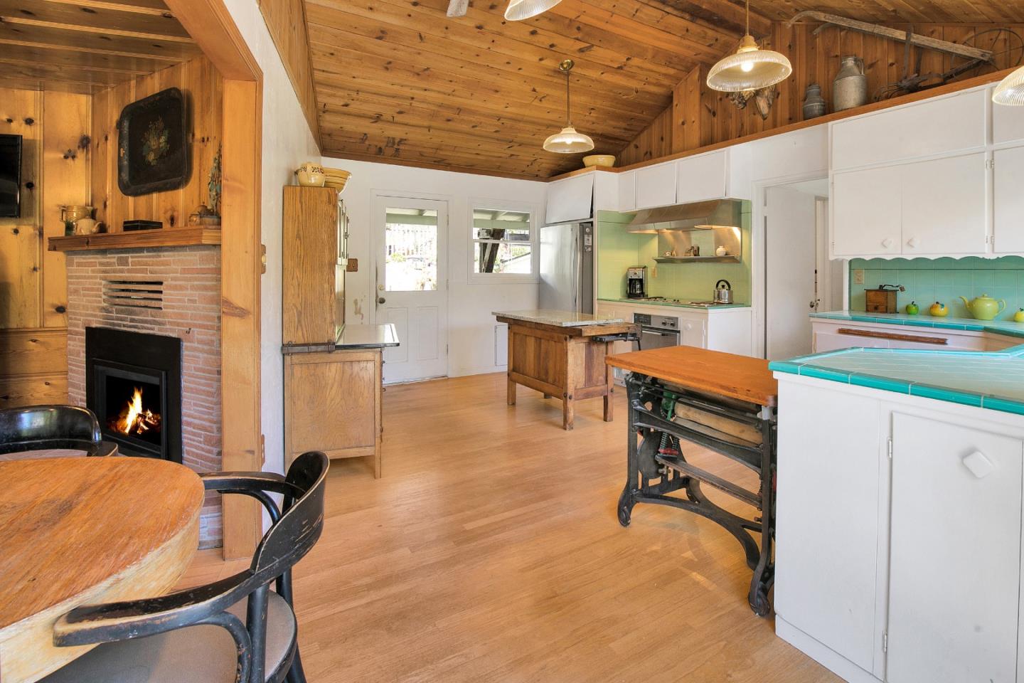 157 Happy Valley Road Santa Cruz, CA 95065 - Photo 15 of 45 a view of a livingroom with furniture and a fireplace