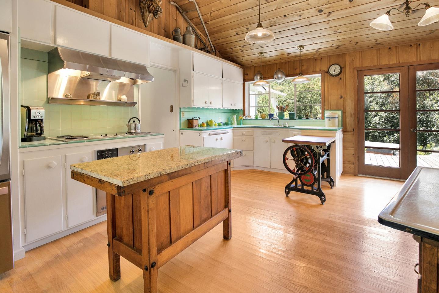 157 Happy Valley Road Santa Cruz, CA 95065 - Photo 20 of 45 a view of a kitchen with a sink a microwave and furniture