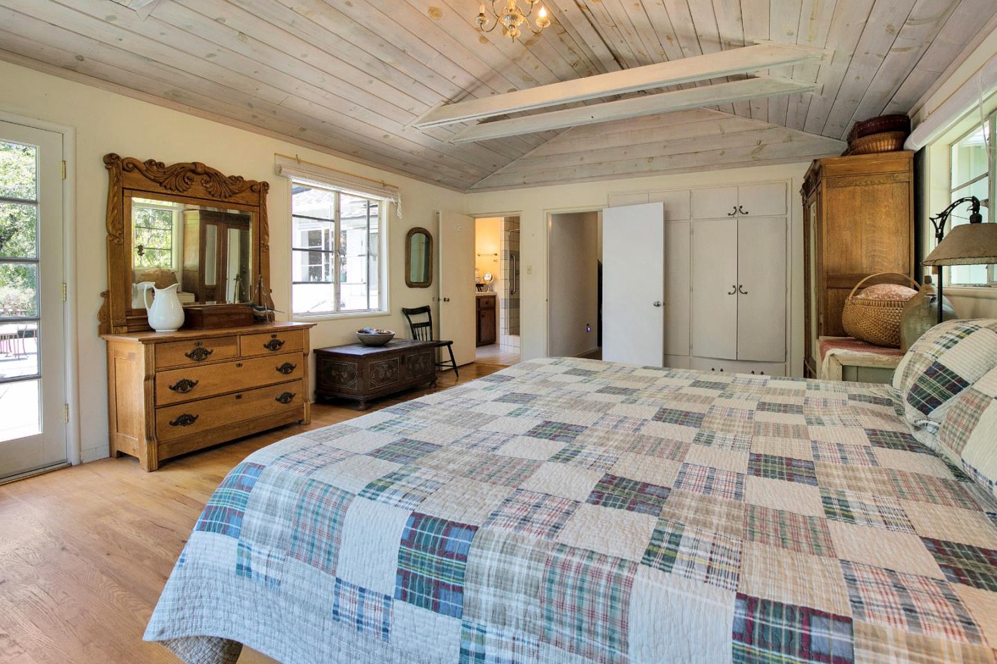 157 Happy Valley Road Santa Cruz, CA 95065 - Photo 25 of 45 a bedroom with a bed and wooden floor