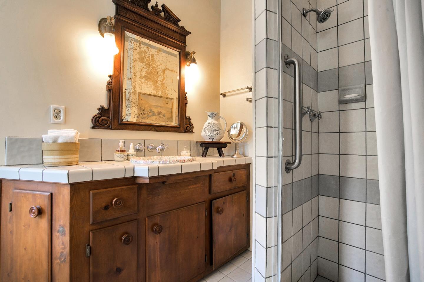 157 Happy Valley Road Santa Cruz, CA 95065 - Photo 26 of 45 a bathroom with a double vanity sink mirror and shower