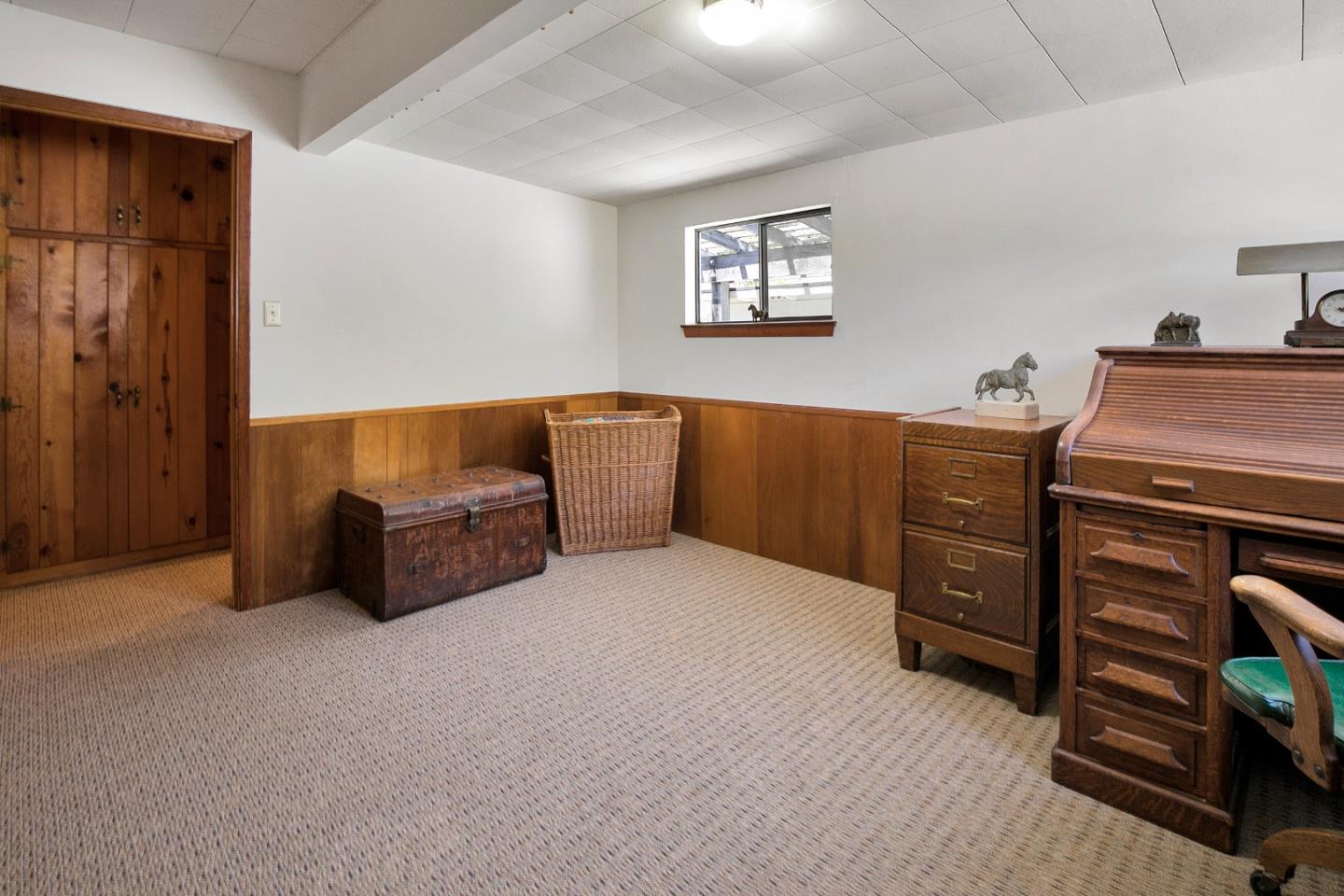 157 Happy Valley Road Santa Cruz, CA 95065 - Photo 29 of 45 a bedroom with furniture and mirror