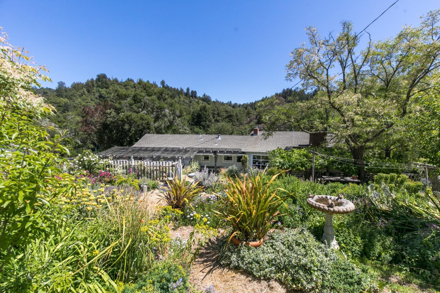157 Happy Valley Road Santa Cruz, CA 95065 - Photo 4 of 45 a view of a garden with a fountain