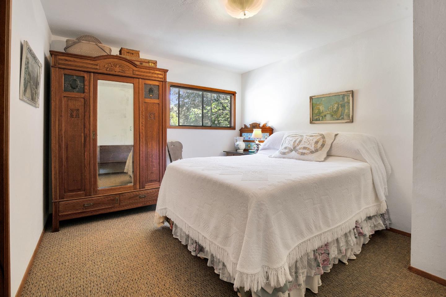 157 Happy Valley Road Santa Cruz, CA 95065 - Photo 31 of 45 a bedroom with bed and window