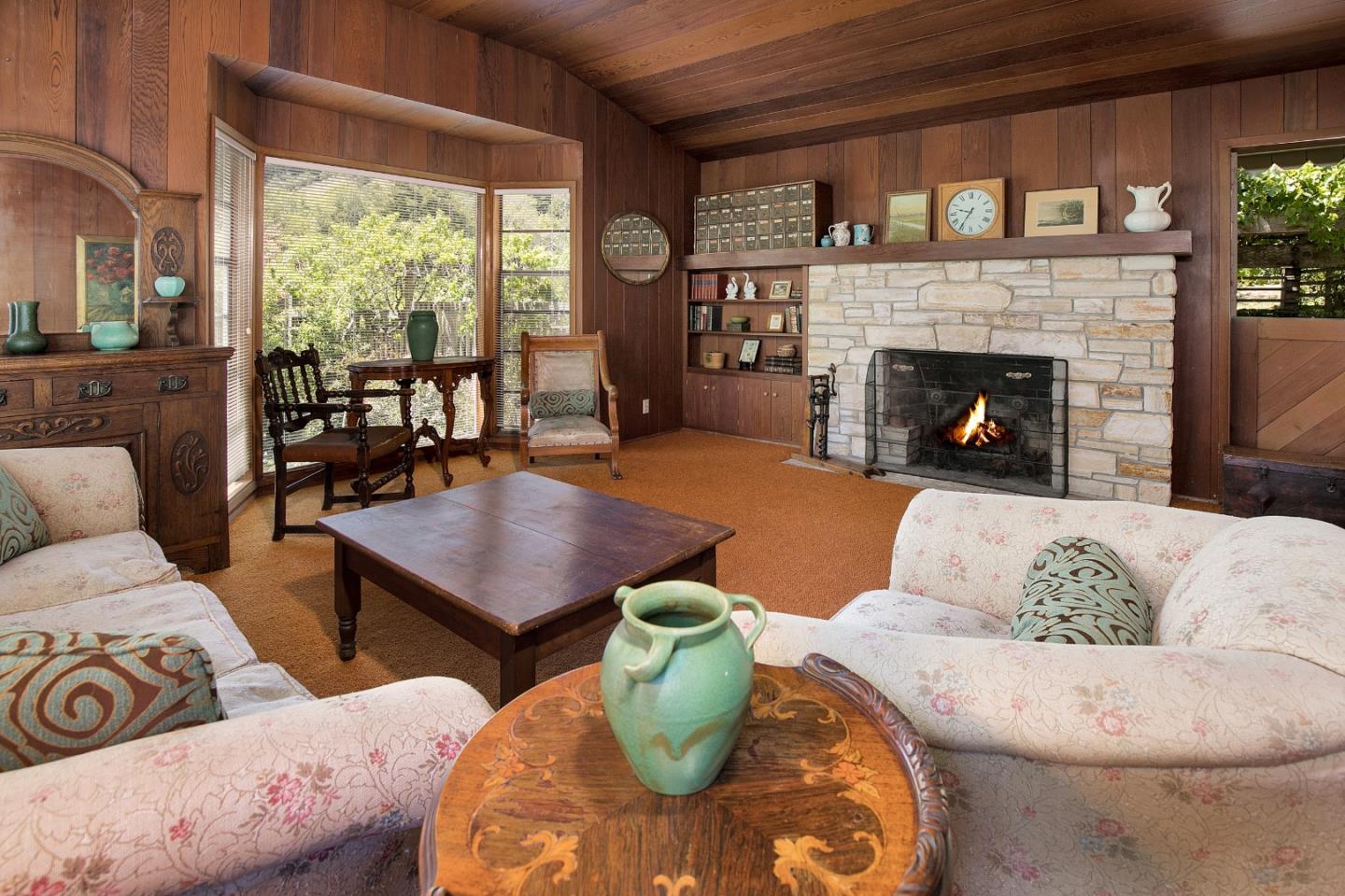 157 Happy Valley Road Santa Cruz, CA 95065 - Photo 10 of 45 a living room with furniture and a fireplace